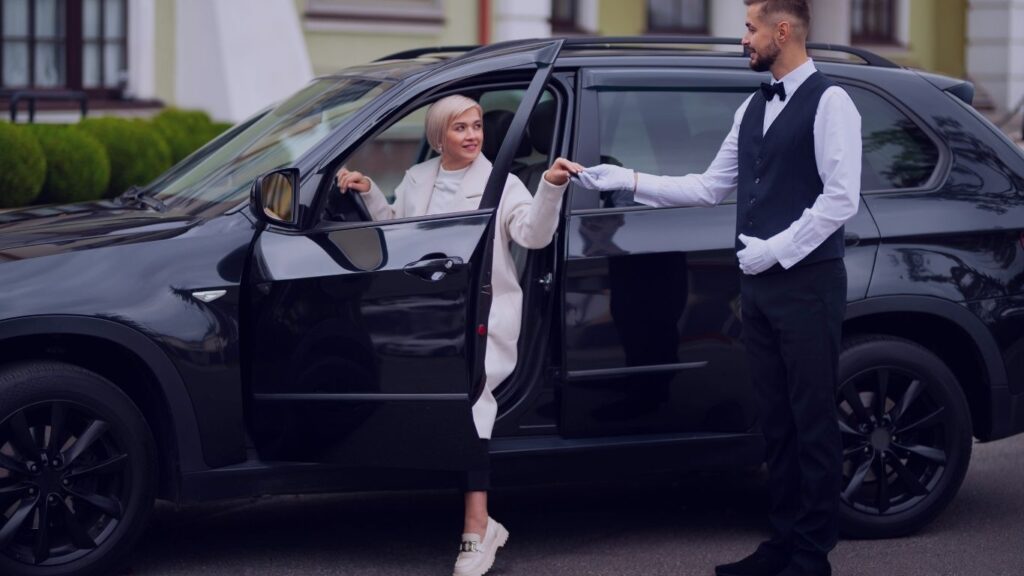parking-valet-his-job-with-vehicle-woman-Ronald-Reagan-Washington-National-Airport-–-Professional-24-hour-DCA-Chauffeur-Black-Car-Service-1.jpg